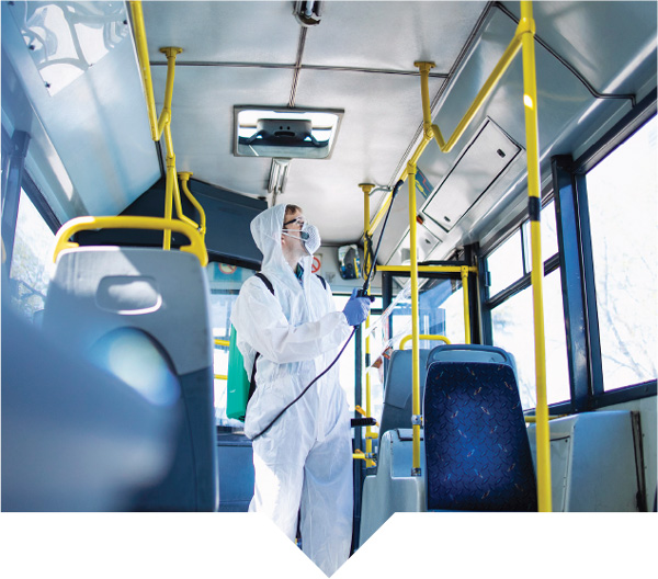 Disinfection Service Personnel inside a bus
